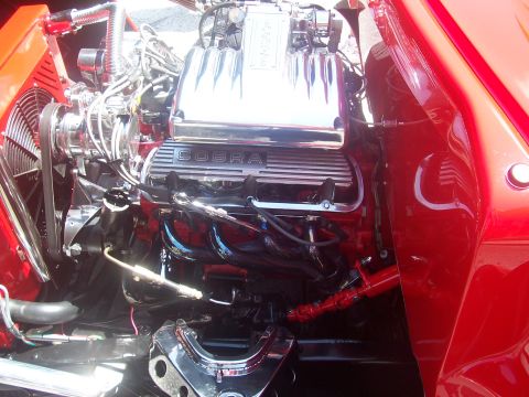 1972 Ford Ranchero - Close-up of a V8 engine with Cobra valve covers and chrome accents.