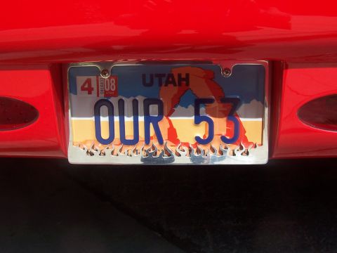 1972 Ford Ranchero - A red vehicle's rear is shown, displaying a Utah license plate with the custom text 'OUR 53'.