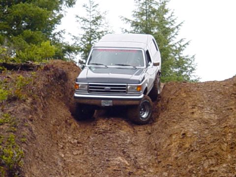 1989 Ford Bronco - This Ford Bronco appears to be from the late 1980s, not a 1989 model, as it navigates a steep dirt incline.