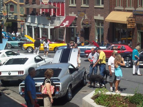 1972 Ford Ranchero - Classic cars on display at a show, including a silver 1969 Ford Mustang Mach 1.