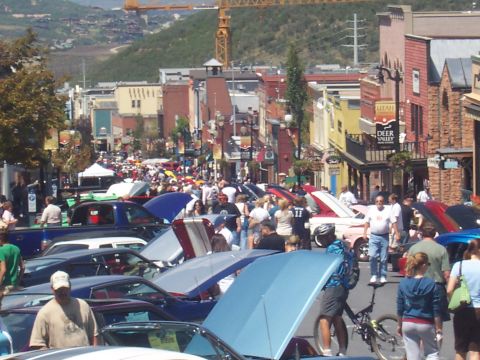 1972 Ford Ranchero - A street filled with vehicles and onlookers suggests a car show event.