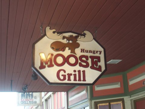 1972 Ford Ranchero - A sign for the Hungry Moose Grill restaurant hangs from a wooden ceiling.