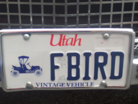 1972 Ford Ranchero - A Utah license plate displays "FBIRD" and a graphic of an old-fashioned automobile, indicating it is a vintage vehicle.