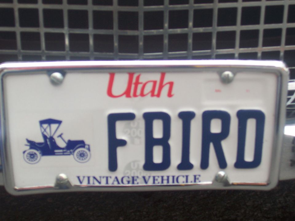 Utah license plate with "FBIRD" and a vintage car graphic, reading "VINTAGE VEHICLE"