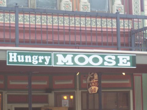 1972 Ford Ranchero - A sign for the Hungry Moose Grill is visible on a building facade.