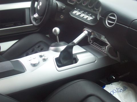 1972 Ford Ranchero - Interior shot of a car's center console and dashboard, showing the shifter and radio.