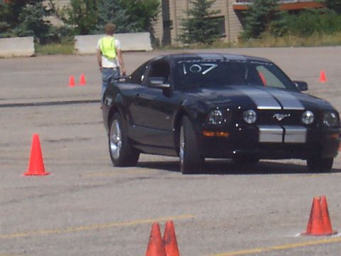 1972 Ford Ranchero - Black Ford Mustang with silver stripes and racing number 107 on windshield.