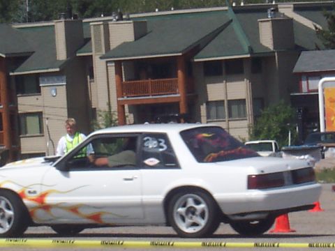 1972 Ford Ranchero - White coupe with flame decals and racing numbers '203' visible on the door.