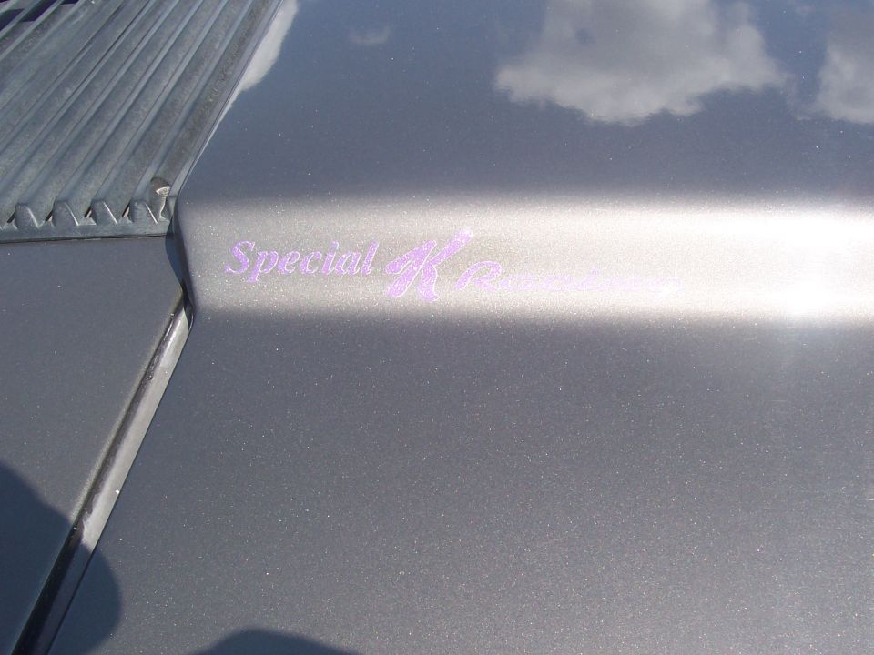Hood emblem reads "Special K" in purple script on a gray vehicle