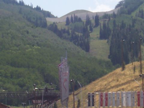 1972 Ford Ranchero - A tall sign for Park City stands against a backdrop of a tree-covered mountain and ski slopes.
