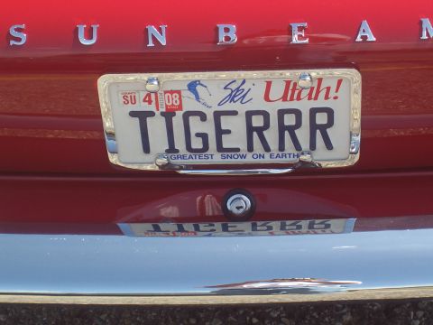 1972 Ford Ranchero - The rear of a red vehicle displays a Utah license plate with a ski theme and the custom text "TIGERRR".