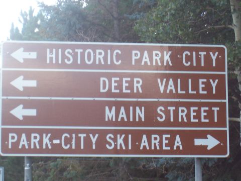 1972 Ford Ranchero - A directional signpost indicates routes to Historic Park City, Deer Valley, Main Street, and the Park-City Ski Area.