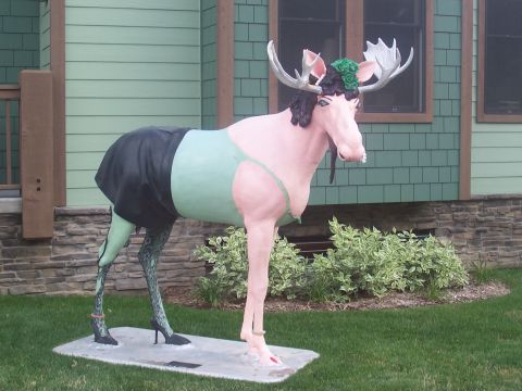 1972 Ford Ranchero - A whimsical moose statue is dressed in a bikini top and skirt, complete with high heels, standing on a lawn.