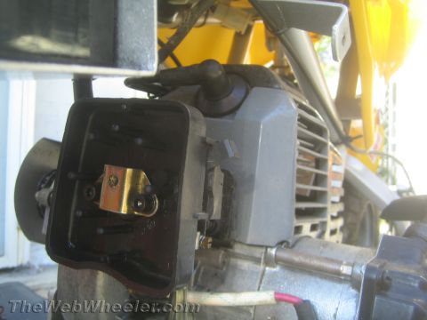 1968 Ford Mustang - The air filter housing is open, revealing the carburetor and linkage mechanism.