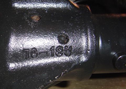 1986 Ford Bronco - Casting numbers '70-189' are visible on this dark metal automotive part.