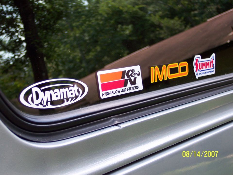 Side window of a vehicle with Dynamat, K&N, IMCO, and Summit stickers. Date stamp 08/14/2007