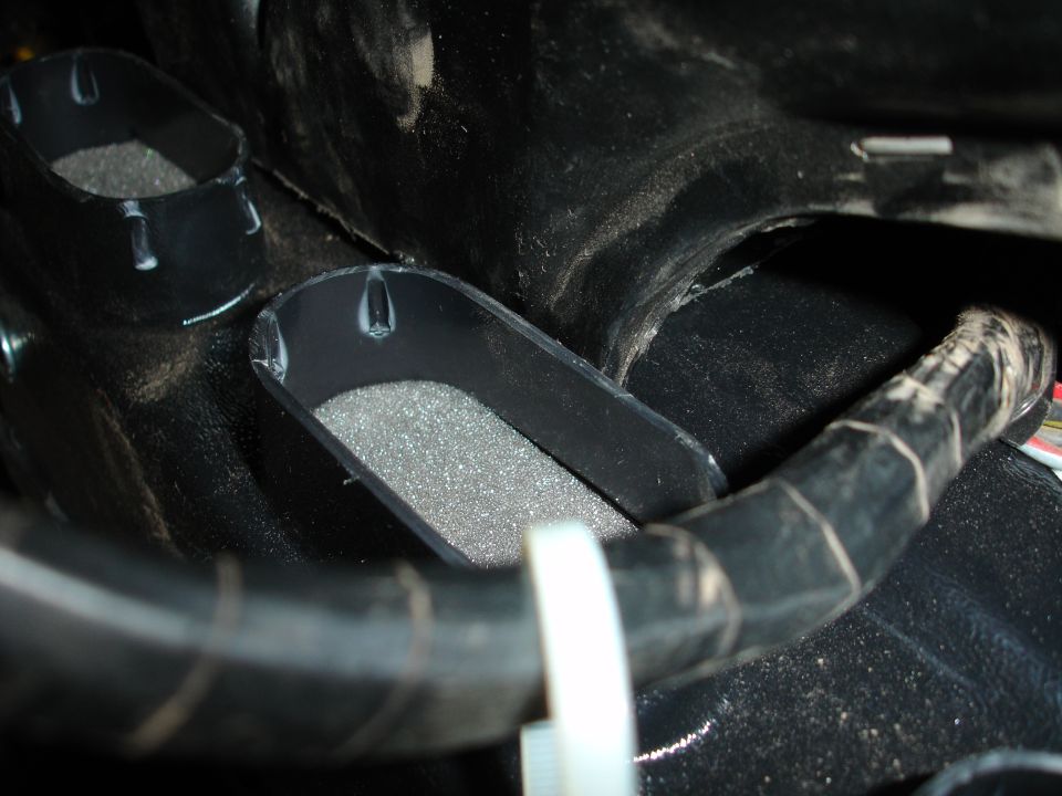 Black interior air vents with foam inserts and a black duct hose
