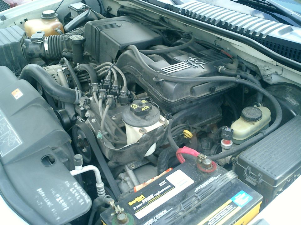 2002 Ford Explorer engine bay with 4.0L SOHC V6 engine