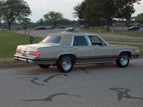 1988 Mercury Grand Marquis - A 1988 Mercury Grand Marquis is viewed from its rear three-quarter angle on a paved surface.