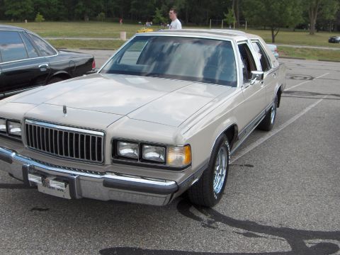 1988 Mercury Grand Marquis - This 1988 Mercury Grand Marquis sedan is shown from the front 3/4 angle in a parking lot.