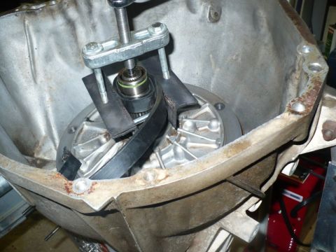 1995 Ford Bronco - Tool being used to service internal components of a transmission housing.