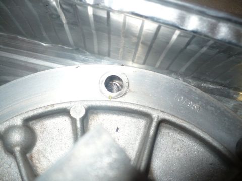 1995 Ford Bronco - A close-up view of a metal component, possibly from an engine, with a visible serial number.
