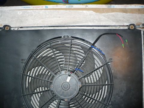 1995 Ford Bronco - An electric cooling fan is shown, with its wiring harness visible.