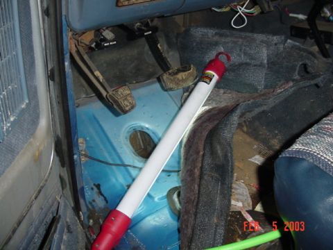 1989 Ford Bronco - Loosten up all the body mount holes... Damn this carpet is wet.