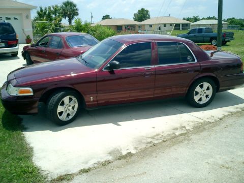 2004 Ford Crown Victoria - Background cars are the inlaws Geo Prizm, and Mercury Villager