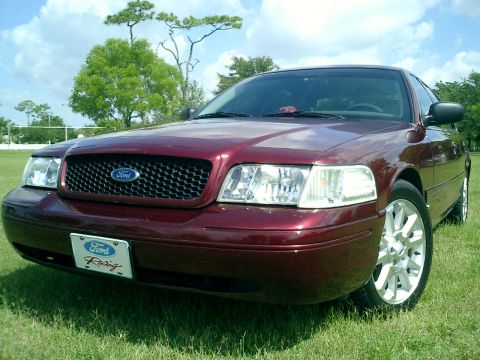 2004 Ford Crown Victoria - This 2004 Ford Crown Victoria features a black grille, custom wheels, and a Ford Racing license plate frame.