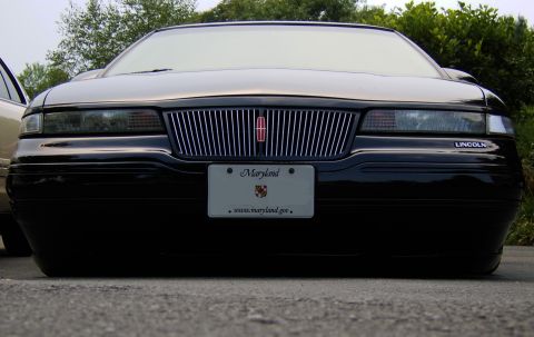 1996 Mercury Grand Marquis - This Lincoln Town Car has a distinctive grille and is lowered close to the ground.