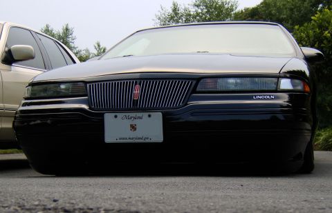 1996 Mercury Grand Marquis - This Lincoln Town Car has a very low stance, appearing to be lowered significantly.