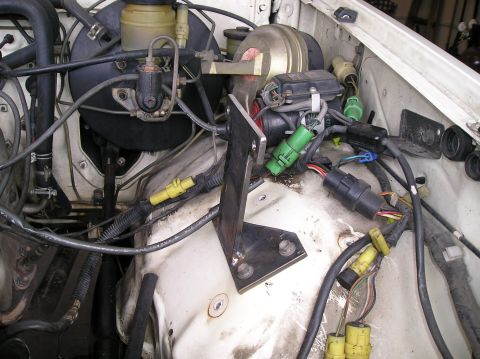 1986 Toyota Hilux - Close-up view of engine bay components, including brake booster and wiring.