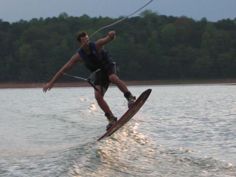1985 Ford LTD Crown Victoria - A wakeboarder performs a trick while being pulled across Lake Hartwell.