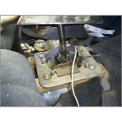 1973 Ford Ranchero - Gear shifter mechanism with visible linkages and cables, likely from an older vehicle.