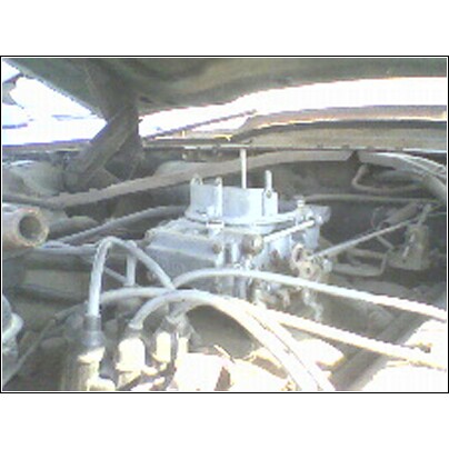 1973 Ford Ranchero - Engine bay detail showing a carburetor and associated components.