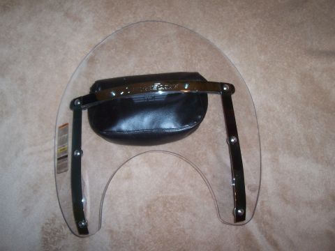 1994 Ford F-150 - A clear motorcycle windshield is shown with a black leather pouch mounted on its chrome hardware.