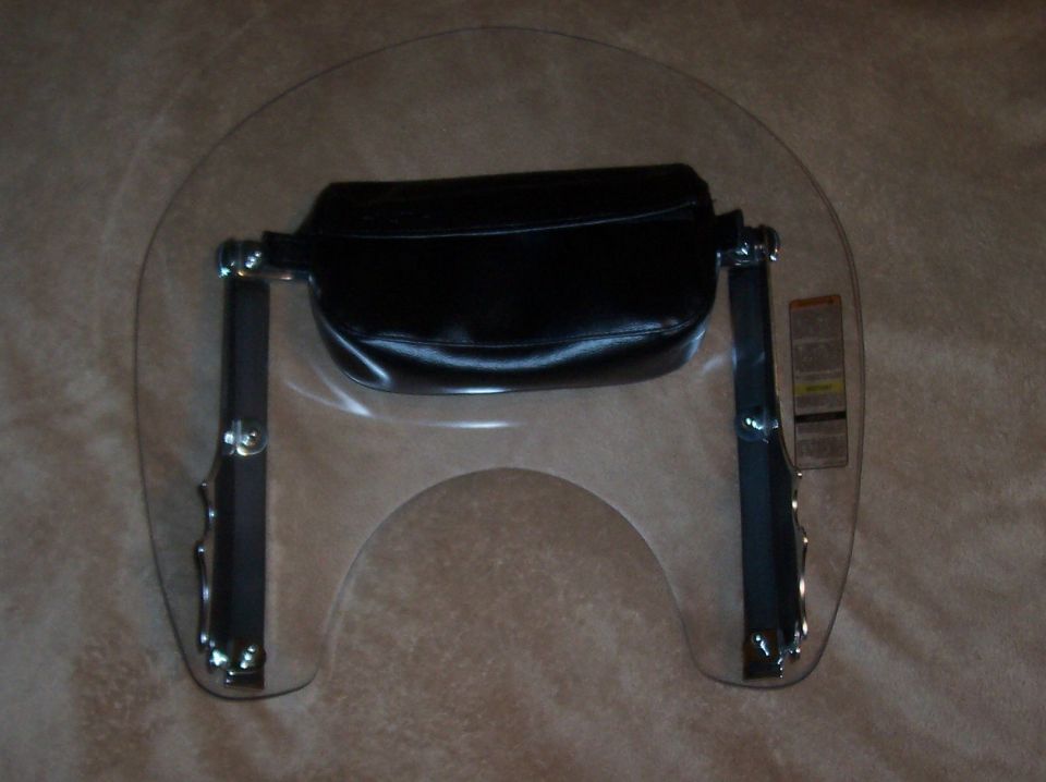 Motorcycle windshield with black leather bag attached to chrome hardware. Label visible on right side