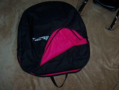 1994 Ford F-150 - A black bag with pink accents and white text is shown, with a portion of a vehicle visible in the background.