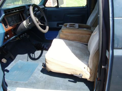 1980 Ford Bronco - Interior view of a 1980 Ford Bronco, the dashboard, steering wheel, and front seats.
