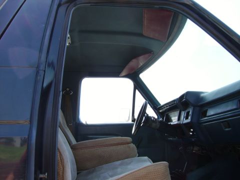 1980 Ford Bronco - Interior view of a 1980 Ford Bronco, showing the dashboard, seats, and steering wheel.