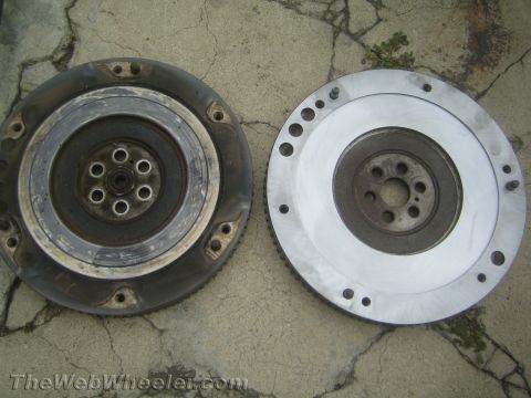 1987 Suzuki Samurai - Comparison of a used and a new flywheel, likely for a vehicle transmission swap.
