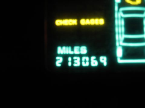 1992 Ford Crown Victoria - A digital dashboard displays a mileage of 213,069 and a "CHECK GAGES" warning light.