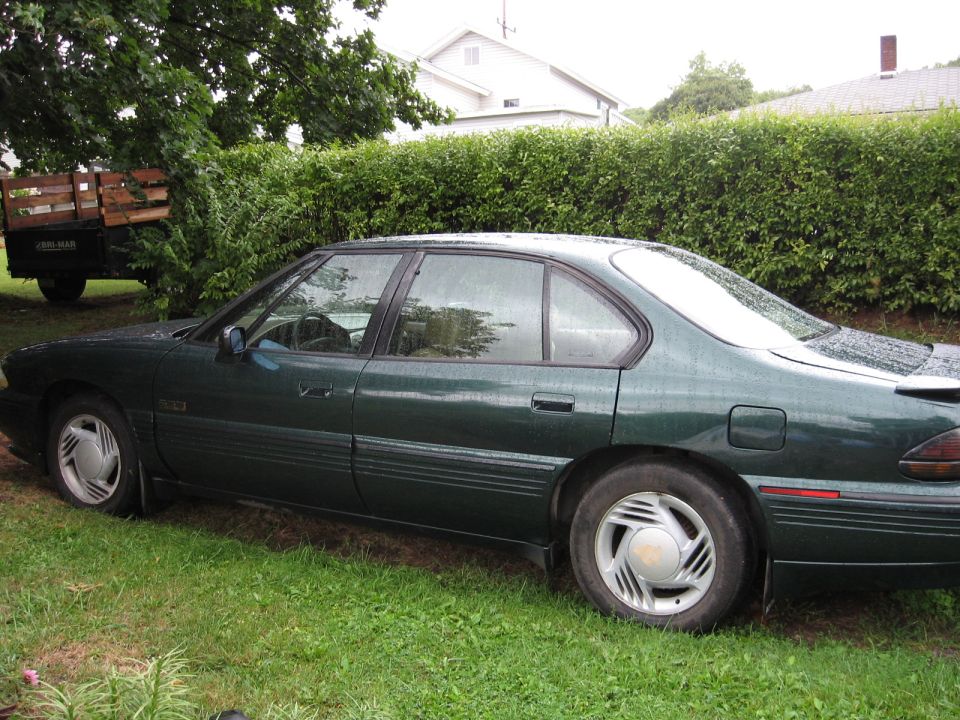 Green sedan side view, 1992 model year