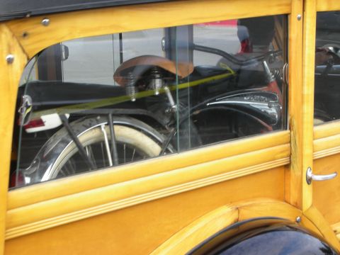 1998 Ford Crown Victoria - A bicycle is seen inside a classic wooden station wagon.
