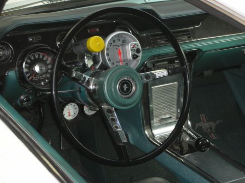 1998 Ford Crown Victoria - Interior view of a 1967 Ford Mustang, a tachometer and floor shifter.