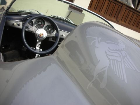 1998 Ford Crown Victoria - The interior of a classic gray Porsche 356 convertible is visible, a distinctive emblem on the hood.
