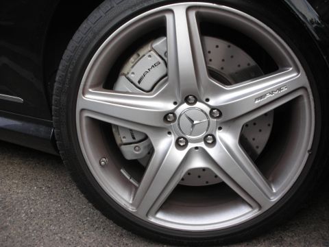 1998 Ford Crown Victoria - Close-up of a Mercedes-Benz wheel and AMG brake caliper.