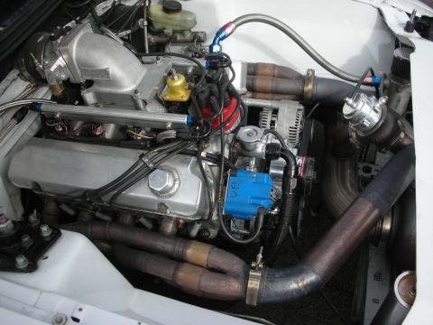 1998 Ford Crown Victoria - Customized engine bay with performance modifications, including a turbocharger and aftermarket intake.