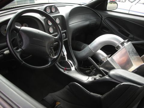 1998 Ford Crown Victoria - Custom interior with Cobra steering wheel and large intake piping visible.